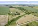 Aerial view of property showing house, barn, and fields at 9996 N County Road 200 W, Muncie, IN 47302