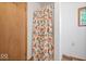 Small bathroom with shower stall and patterned curtain at 9996 N County Road 200 W, Muncie, IN 47302