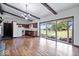 Kitchen with hardwood floors, white appliances, and sliding doors to backyard at 9996 N County Road 200 W, Muncie, IN 47302