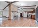 Open kitchen and living area with hardwood floors and white appliances at 9996 N County Road 200 W, Muncie, IN 47302