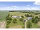 Aerial view of a house with large yard and outbuildings at 9996 N County Road 200 W, Muncie, IN 47302