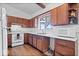 Kitchen features wood cabinets, white appliances, and hardwood floors at 9996 N County Road 200 W, Muncie, IN 47302