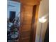 Image of an antique wood pocket door leading into what appears to be a cluttered room at 3526 N Capitol Ave, Indianapolis, IN 46208