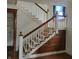 View of a white and wood staircase with decorative woodwork at 3526 N Capitol Ave, Indianapolis, IN 46208