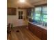 Simple kitchen with wood cabinets and flooring at 3526 N Capitol Ave, Indianapolis, IN 46208