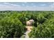 Luxury home surrounded by lush trees and landscaping at 841 Alverna Dr, Indianapolis, IN 46260