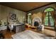 Luxurious main bedroom with a fireplace and large windows at 841 Alverna Dr, Indianapolis, IN 46260