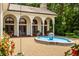 Tranquil courtyard featuring a unique fountain and lush greenery at 841 Alverna Dr, Indianapolis, IN 46260