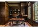 Spacious home office with built-in bookshelves and a large desk at 841 Alverna Dr, Indianapolis, IN 46260