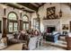Luxurious living room with comfortable seating, grand fireplace, and large windows at 841 Alverna Dr, Indianapolis, IN 46260