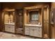 Double vanity bathroom with a large mirror and custom cabinetry at 841 Alverna Dr, Indianapolis, IN 46260