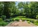 Serene backyard setting with lush greenery and a grassy lawn at 841 Alverna Dr, Indianapolis, IN 46260