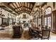 Elegant dining room with a large table, high ceilings, and intricate woodwork at 841 Alverna Dr, Indianapolis, IN 46260