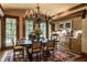 Charming dining room with a large table, chandelier, and hardwood floors at 841 Alverna Dr, Indianapolis, IN 46260