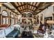 Grand living room boasts high ceilings, intricate woodwork, and ample seating at 841 Alverna Dr, Indianapolis, IN 46260