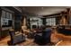 Spacious recreation room with fireplace, seating area, and wet bar at 841 Alverna Dr, Indianapolis, IN 46260