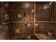 Large walk-in shower with hexagon tile and multiple shower heads at 841 Alverna Dr, Indianapolis, IN 46260