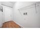 Laundry area with wood flooring and shelving for storage at 1728 Lexington Ave, Indianapolis, IN 46203