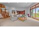 Open living room with L-shaped sofa, access to backyard, and view to dining room at 3917 N 525 W, Fairland, IN 46126