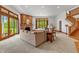 Spacious living room with brick fireplace, large windows, and views of the backyard at 3917 N 525 W, Fairland, IN 46126