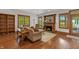 Cozy living room with hardwood floors, fireplace, and large windows at 3917 N 525 W, Fairland, IN 46126