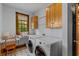 Laundry room with washer, dryer, cabinets, and built-in workspace at 3917 N 525 W, Fairland, IN 46126