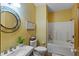 Small bathroom with a bathtub, toilet, and sink at 3917 N 525 W, Fairland, IN 46126