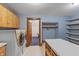 Laundry room with washer, dryer, and ample shelving at 3917 N 525 W, Fairland, IN 46126