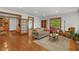 Open living room with hardwood floors and views into the kitchen at 3917 N 525 W, Fairland, IN 46126