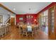 Formal dining room with round table and chairs, leading to a sunroom at 3917 N 525 W, Fairland, IN 46126