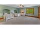 Bedroom with two twin beds, built-in shelving, and a window at 3917 N 525 W, Fairland, IN 46126