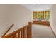 Upstairs landing with window seat and wood railing at 3917 N 525 W, Fairland, IN 46126