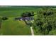 Aerial view of house, private tennis court, and expansive green space at 3917 N 525 W, Fairland, IN 46126