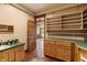 Laundry room with green countertops, wooden cabinets, and shelving at 3917 N 525 W, Fairland, IN 46126