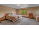 Bedroom with a queen bed, wooden dresser, and large window at 3917 N 525 W, Fairland, IN 46126