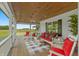 Relaxing front porch with rocking chairs and a view of the countryside at 3917 N 525 W, Fairland, IN 46126