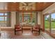 Sunroom features brick flooring, window seat, and views of the backyard at 3917 N 525 W, Fairland, IN 46126