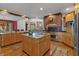 Large kitchen with island, stainless steel appliances, and wood cabinets at 3917 N 525 W, Fairland, IN 46126