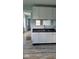 New kitchen with white cabinets, dark countertop, and vinyl flooring at 41 S Sherman Dr, Indianapolis, IN 46201