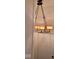 Elegant chandelier with beige shades above a white door at 41 S Sherman Dr, Indianapolis, IN 46201