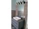 Modern bathroom with gray vanity, vessel sink, and updated light fixture at 41 S Sherman Dr, Indianapolis, IN 46201