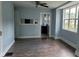 Dining room with light blue walls, dark gray vinyl flooring, and kitchen view at 41 S Sherman Dr, Indianapolis, IN 46201