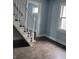 Living room featuring hardwood floors and a staircase at 41 S Sherman Dr, Indianapolis, IN 46201