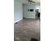 Dining room with light blue walls, dark gray vinyl flooring, and kitchen view at 41 S Sherman Dr, Indianapolis, IN 46201