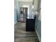 Modern kitchen with stainless steel appliances and light wood vinyl flooring at 41 S Sherman Dr, Indianapolis, IN 46201
