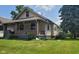 House exterior with front porch and lawn at 41 S Sherman Dr, Indianapolis, IN 46201