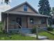 House exterior with front porch and yard at 41 S Sherman Dr, Indianapolis, IN 46201