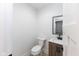 Small bathroom with a toilet and pedestal sink at 706 S Main St, Whitestown, IN 46075