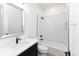 Clean bathroom with white subway tile, a bathtub, and quartz countertop at 706 S Main St, Whitestown, IN 46075