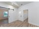 Bright entryway with barn door and hardwood floors at 706 S Main St, Whitestown, IN 46075